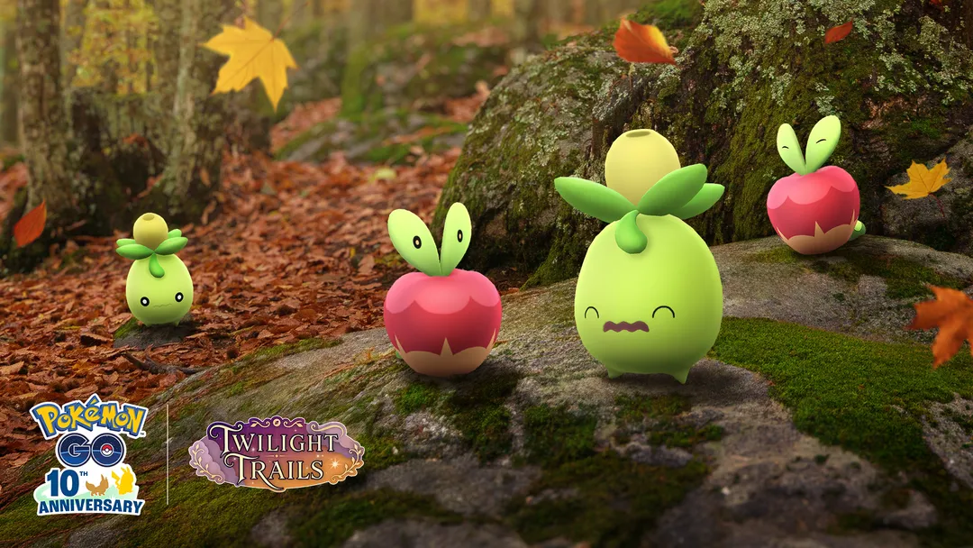 Harvest Festival official artwork showing two Applin and two Smoliv on a mossy rock among autumn leaves