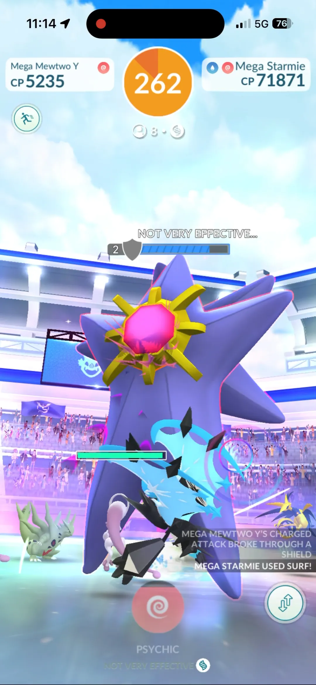 Raid battle screen showing 2 shields remaining after Mega Mewtwo Y's Charged Attack broke through a shield